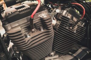 Detailed view of a motorcycle engine showcasing intricate mechanical parts and design.